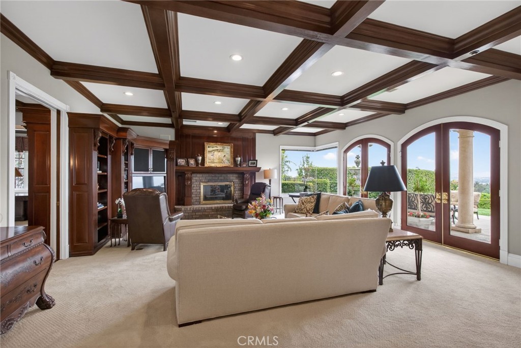 6952 Royal Hunt Ridge Drive Riverside, CA 92506 - Photo 25 of 75 a living room with furniture and a large window