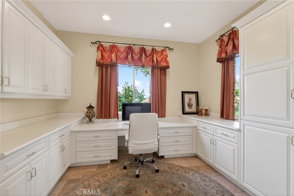 6952 Royal Hunt Ridge Drive Riverside, CA 92506 - Photo 33 of 75 a kitchen with a sink cabinets and window
