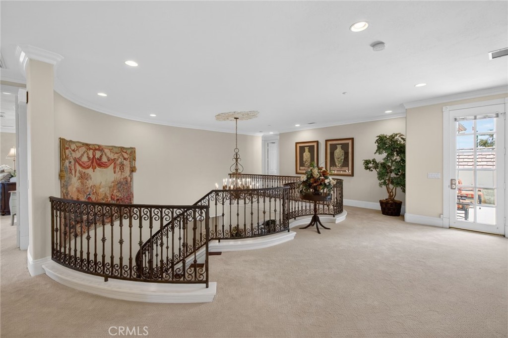 6952 Royal Hunt Ridge Drive Riverside, CA 92506 - Photo 36 of 75 a view of a hallway with workspace and furniture