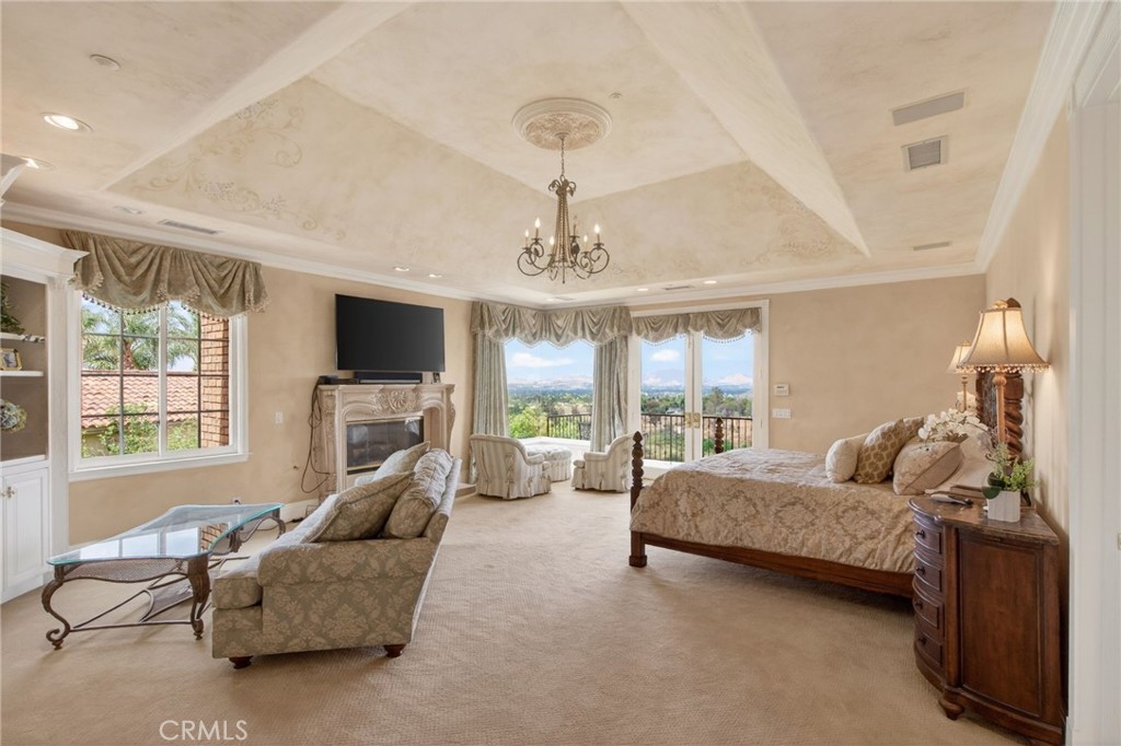 6952 Royal Hunt Ridge Drive Riverside, CA 92506 - Photo 37 of 75 a living room with furniture and a flat screen tv