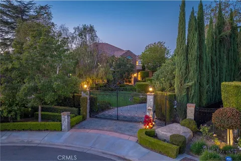 an aerial view of house with swimming pool outdoor seating and yard