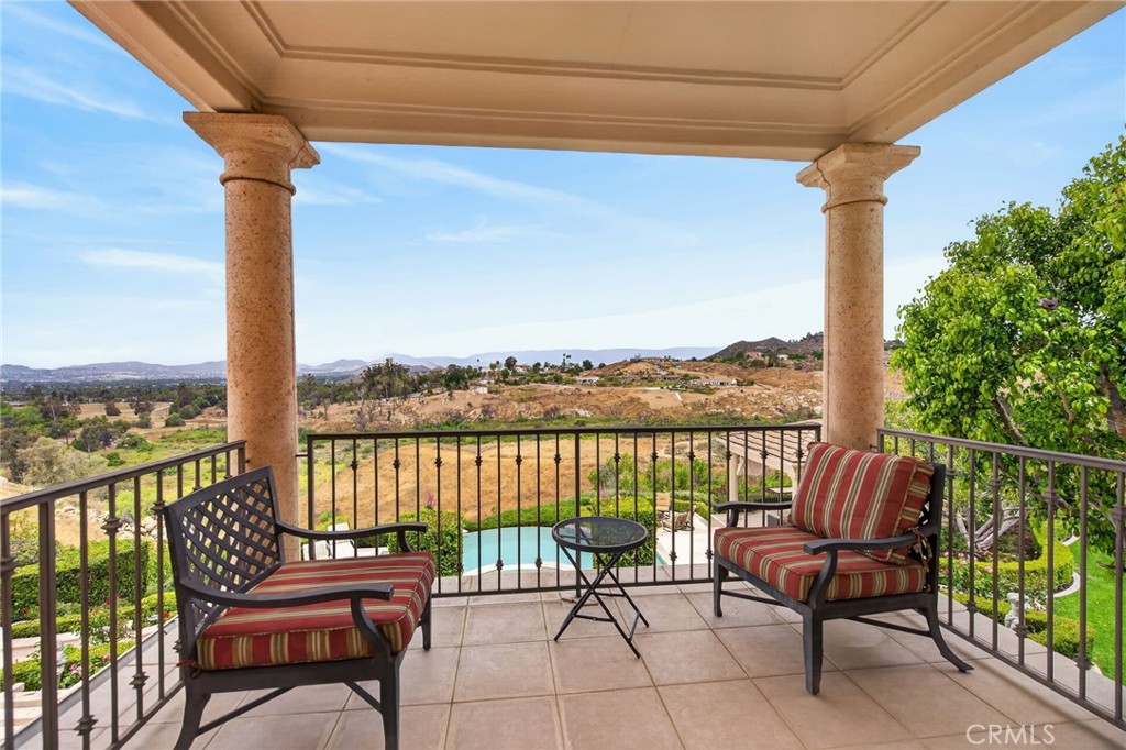 6952 Royal Hunt Ridge Drive Riverside, CA 92506 - Photo 52 of 75 a view of a chair and table in the balcony