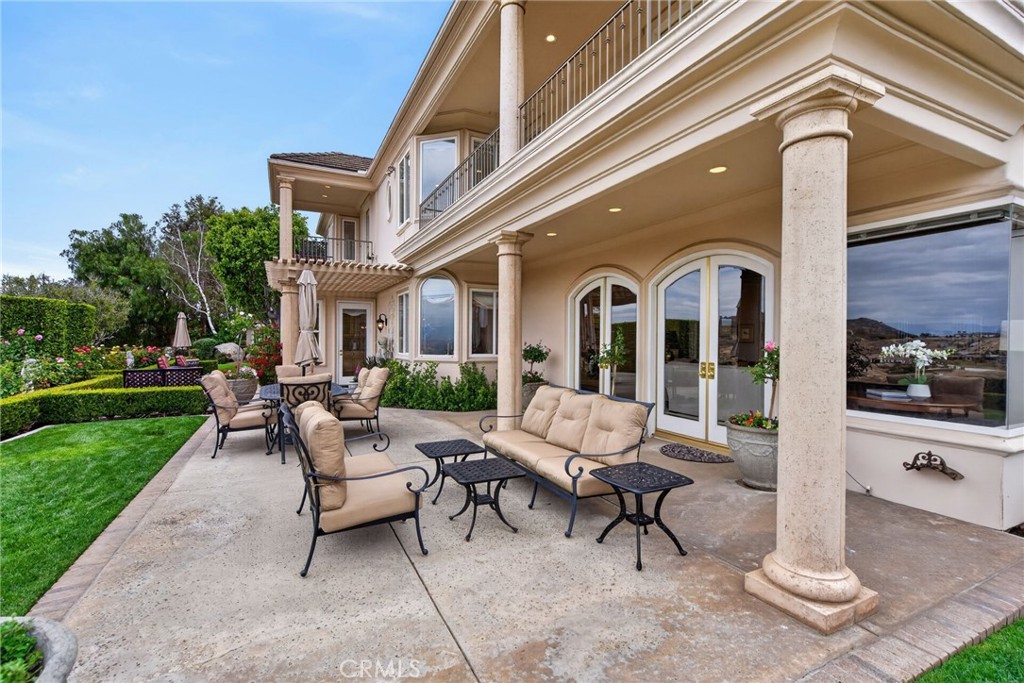 6952 Royal Hunt Ridge Drive Riverside, CA 92506 - Photo 53 of 75 a building outdoor space with patio furniture and garden