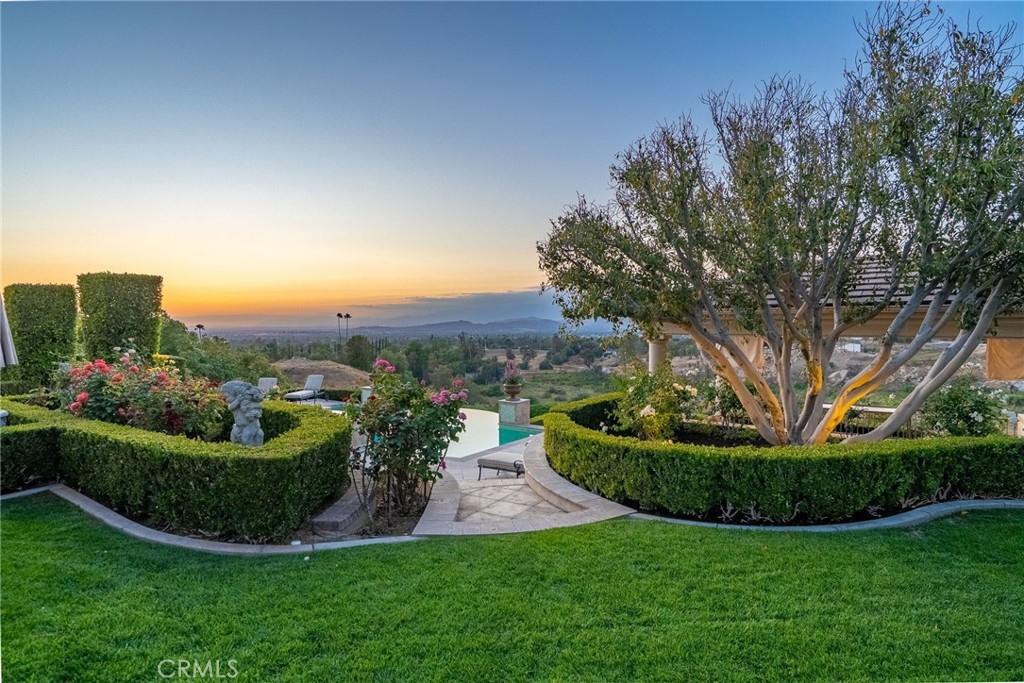 6952 Royal Hunt Ridge Drive Riverside, CA 92506 - Photo 57 of 75 a view of a garden with a fountain