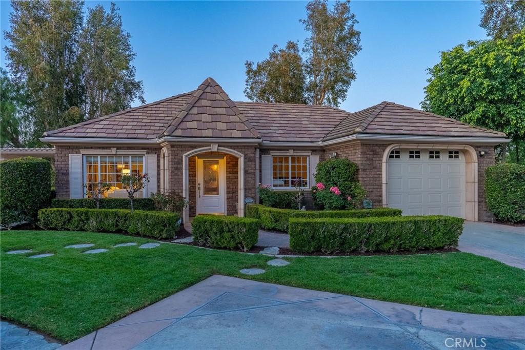 6952 Royal Hunt Ridge Drive Riverside, CA 92506 - Photo 63 of 75 a front view of a house with a yard