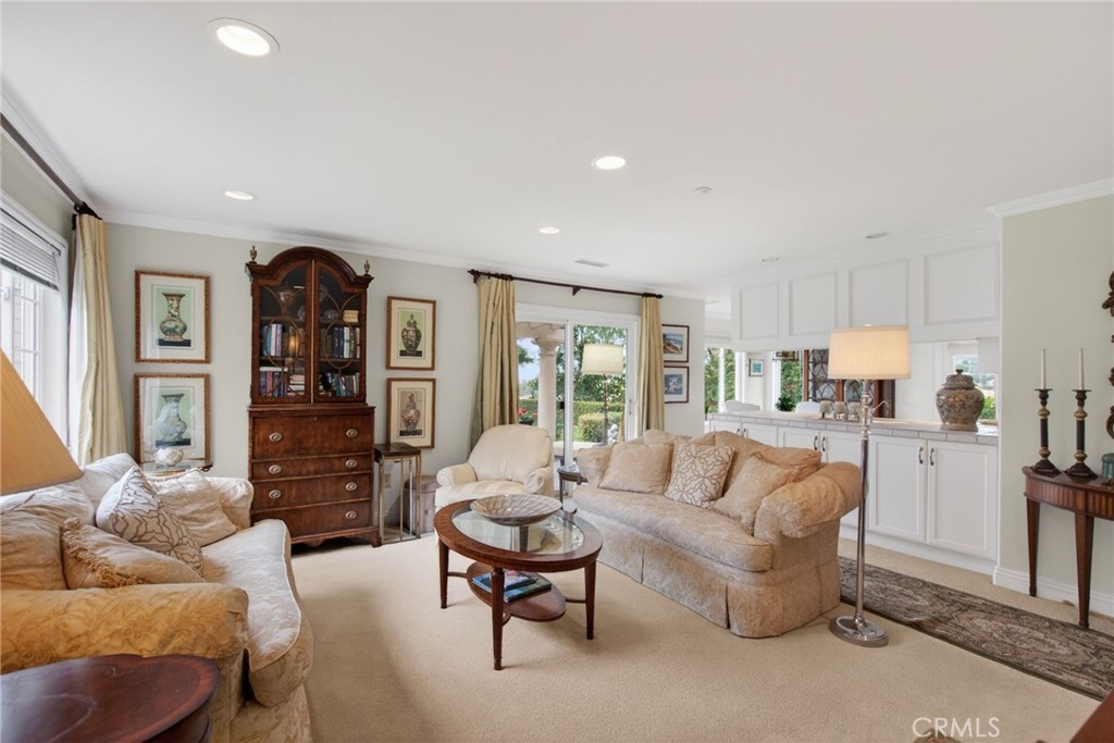 6952 Royal Hunt Ridge Drive Riverside, CA 92506 - Photo 66 of 75 a living room with furniture and a dining table with kitchen view