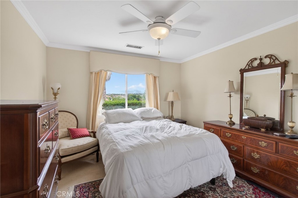 6952 Royal Hunt Ridge Drive Riverside, CA 92506 - Photo 70 of 75 a bedroom with a bed and a dresser