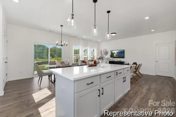 a open kitchen with a table and chairs in it