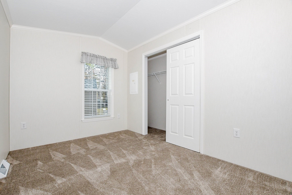 3040 Cranberry Highway, Unit 32 Wareham, MA 02538 - Photo 21 of 25 an empty room with windows