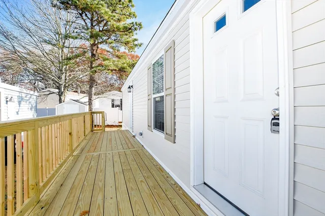 a view of a balcony with wooden floor
