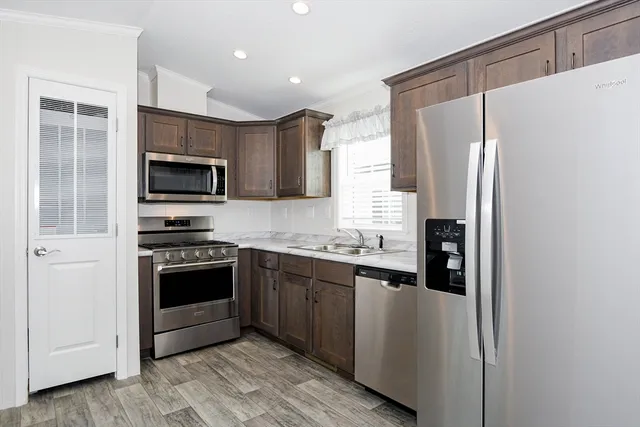 a kitchen that has a sink and a stove