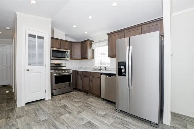 a view of a kitchen with a sink and a window