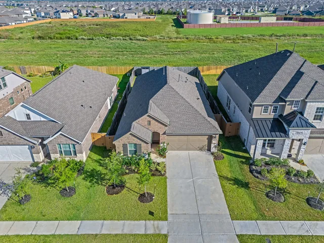 an aerial view of a house having outdoor space patio and swimming pool