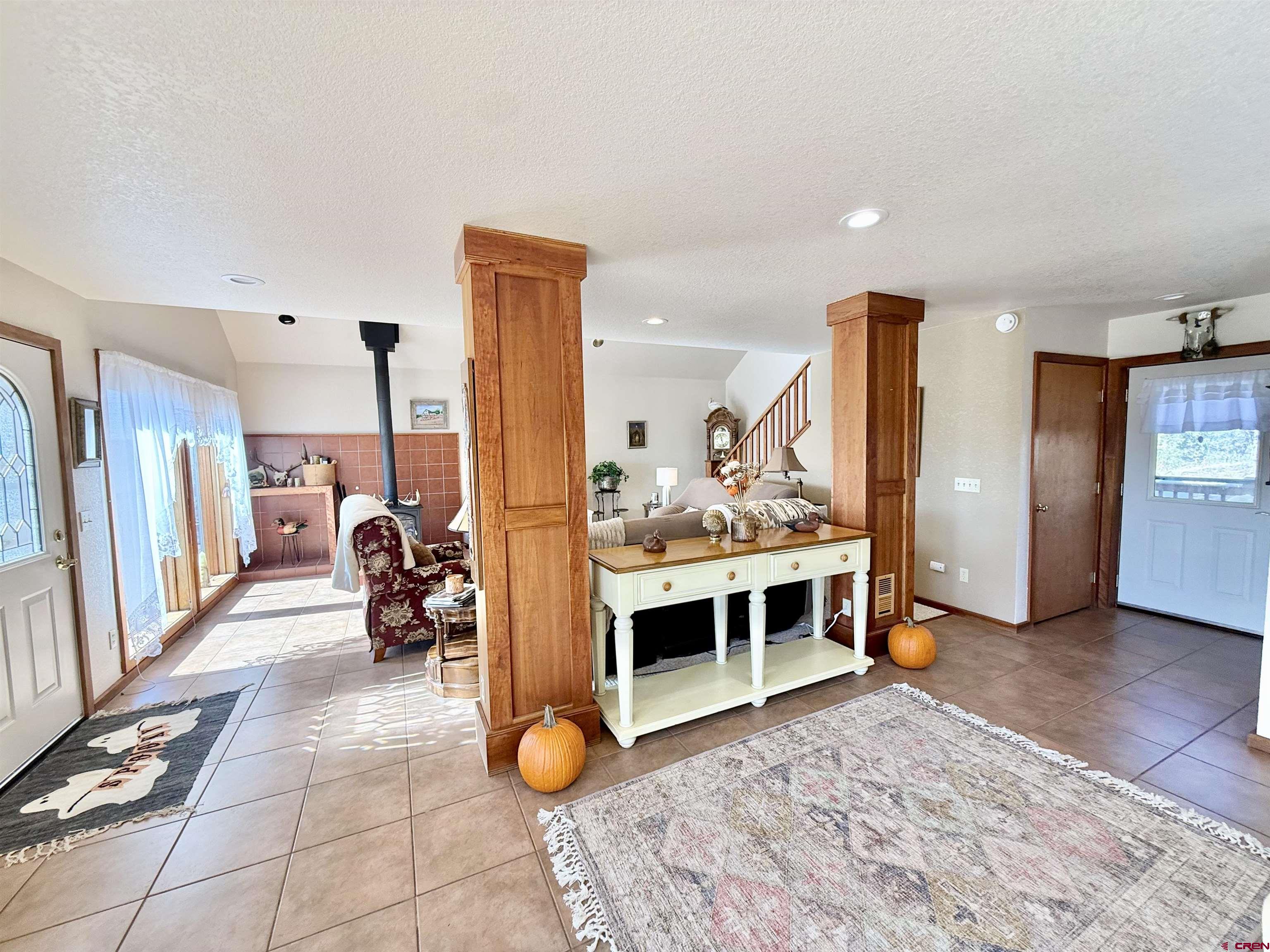 10528 Bostwick Park Road Montrose, CO 81401 - Photo 6 of 43 a view of a living room and bathroom