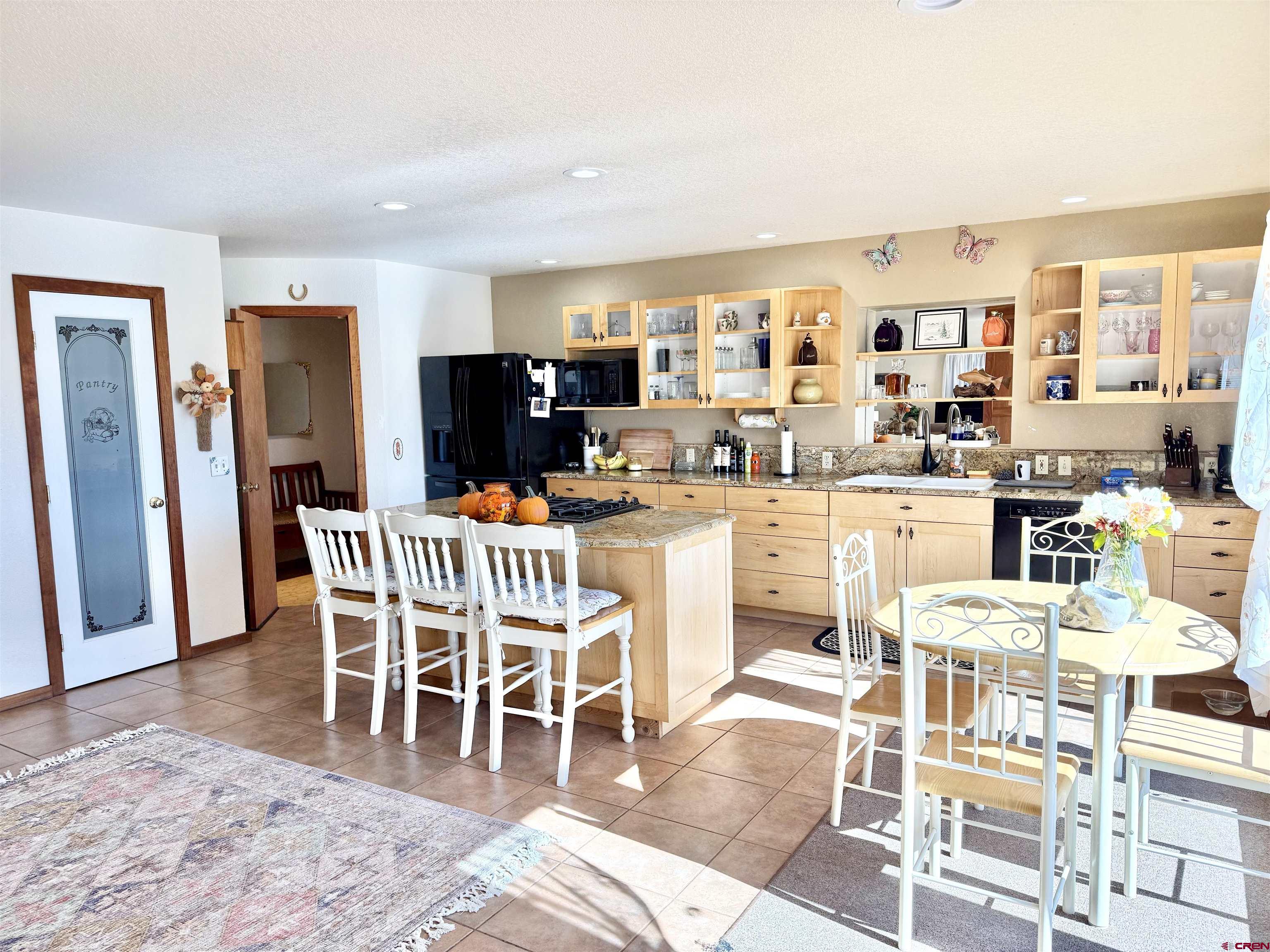10528 Bostwick Park Road Montrose, CO 81401 - Photo 9 of 43 a dining room with furniture and wooden floor