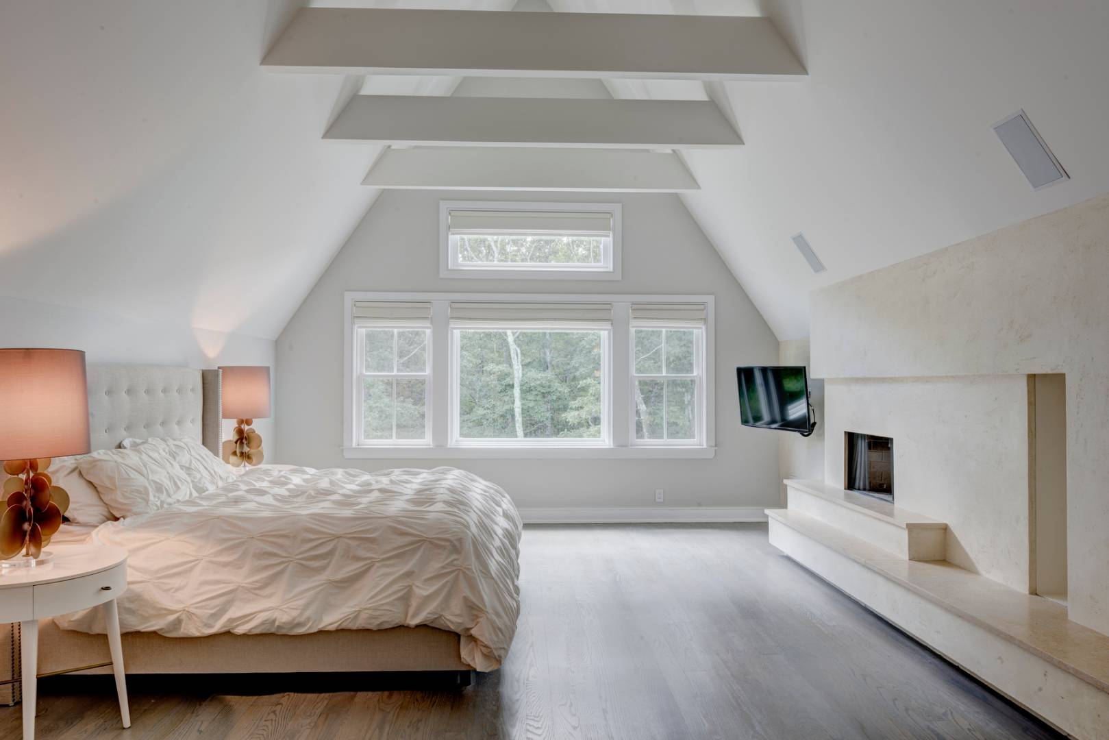 4 Paumanok Road Sag Harbor, NY 11963 - Photo 7 of 8 a spacious bedroom with a bed and a large window
