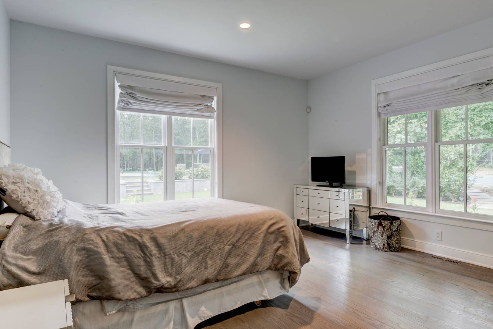 4 Paumanok Road Sag Harbor, NY 11963 - Photo 8 of 8 a bedroom with a bed and a flat screen tv