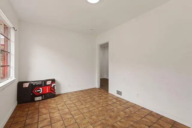 a view of an empty room with windows