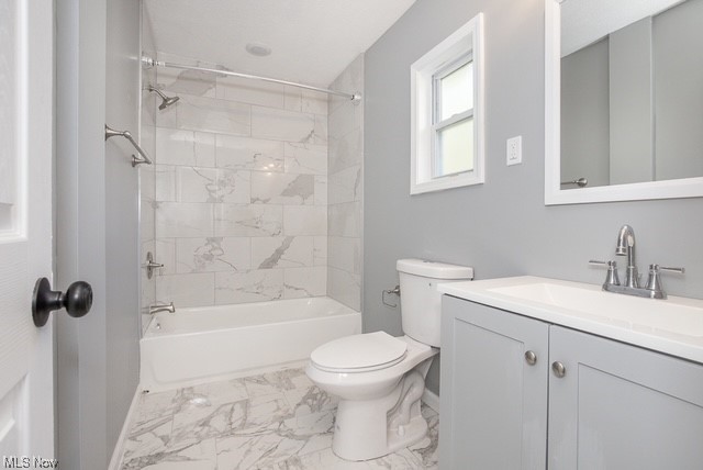 7214 Ottawa Road Cleveland, OH 44105 - Photo 22 of 25 Full bathroom with tile flooring, toilet, vanity, and tiled shower / bath combo