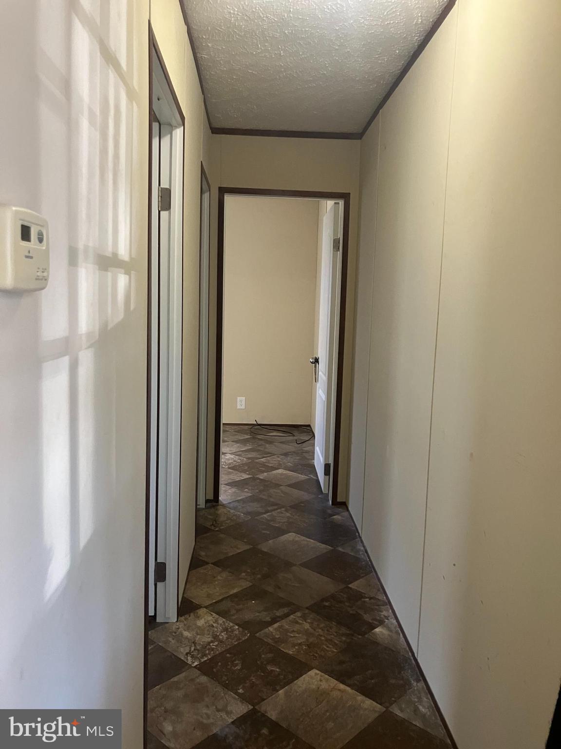 14201 Winchester Road Southwest Cumberland, MD 21502 - Photo 12 of 17 a view of a hallway with wooden floor and entryway