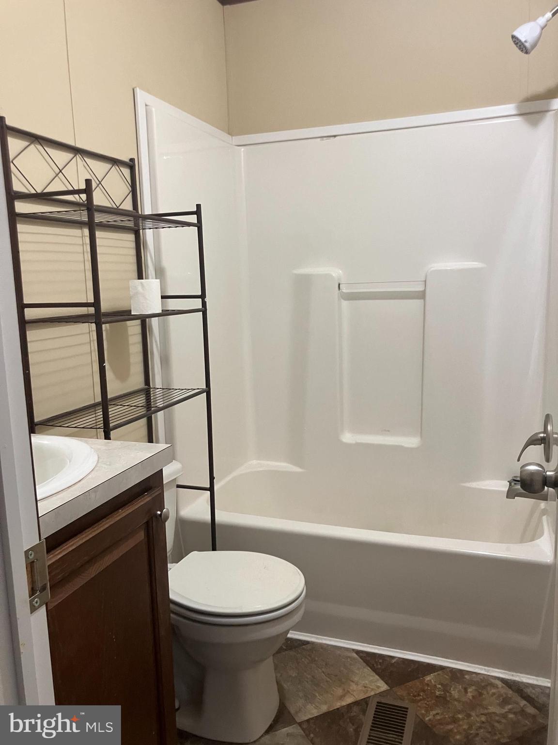 14201 Winchester Road Southwest Cumberland, MD 21502 - Photo 13 of 17 a bathroom with a toilet a sink and bathtub