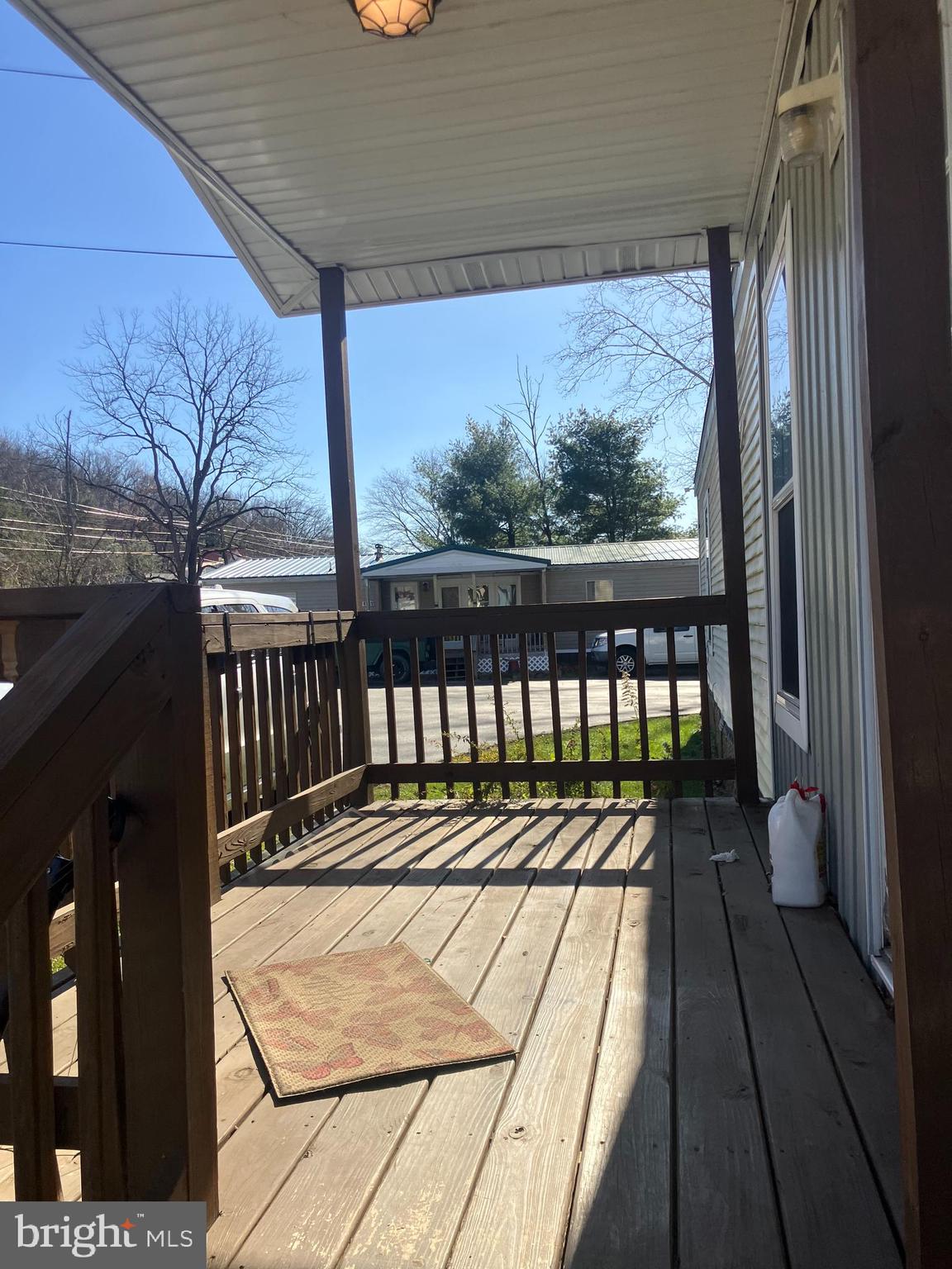 14201 Winchester Road Southwest Cumberland, MD 21502 - Photo 3 of 17 a balcony with wooden floor