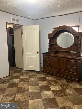 a bathroom with a mirror and a sink