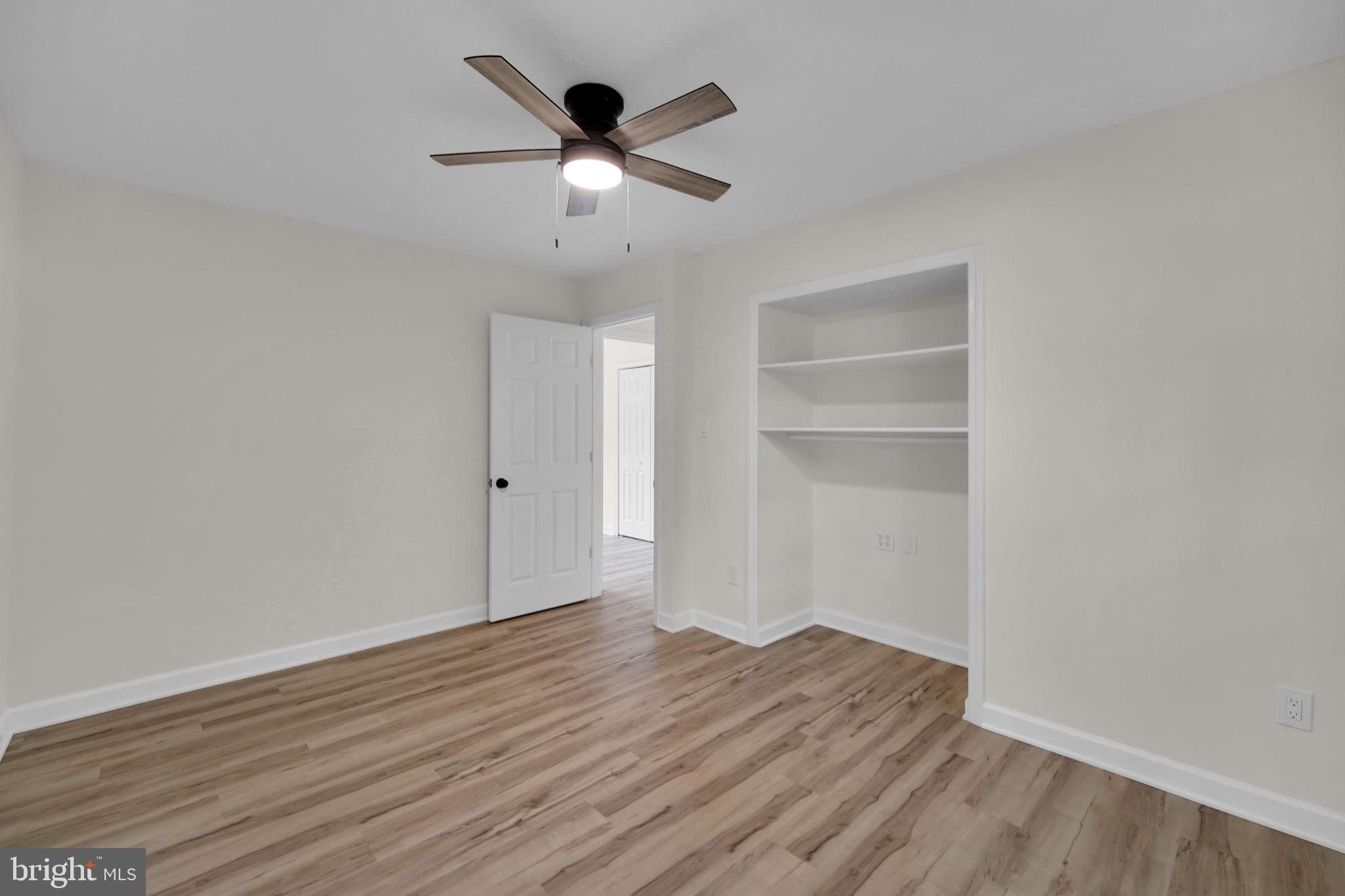 8613 Weems Road Manassas, VA 20110 - Photo 11 of 50 a view of an empty room with wooden floor