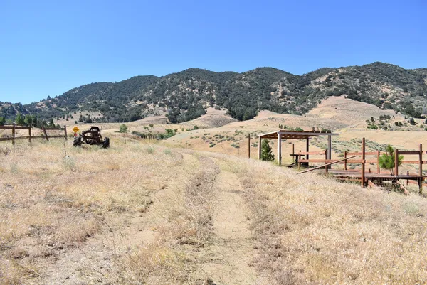 a view of a terrace with chairs and wooden floor