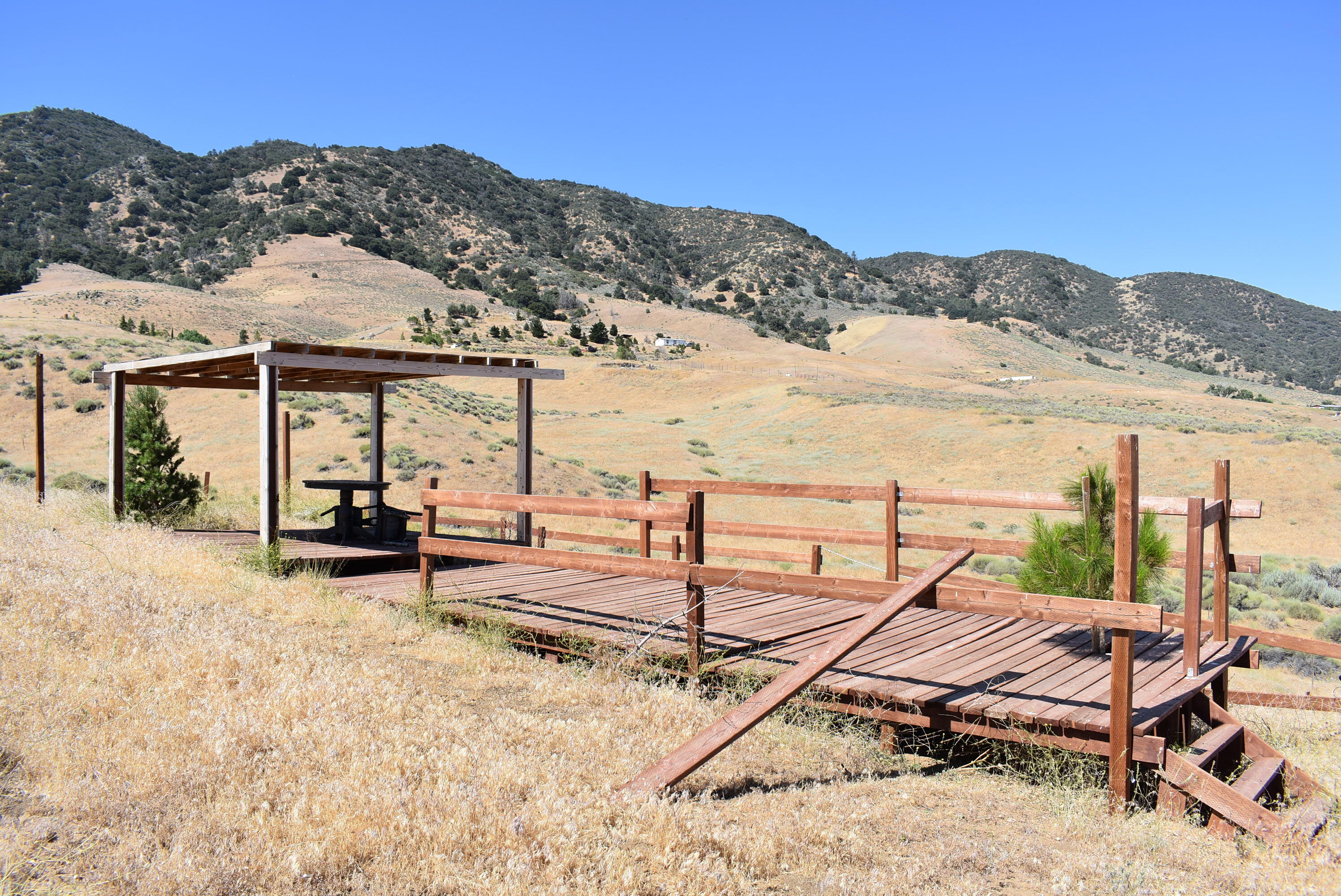 Ottawa Drive Tehachapi, CA 93561 - Photo 9 of 24 a view of a terrace with chairs and wooden floor