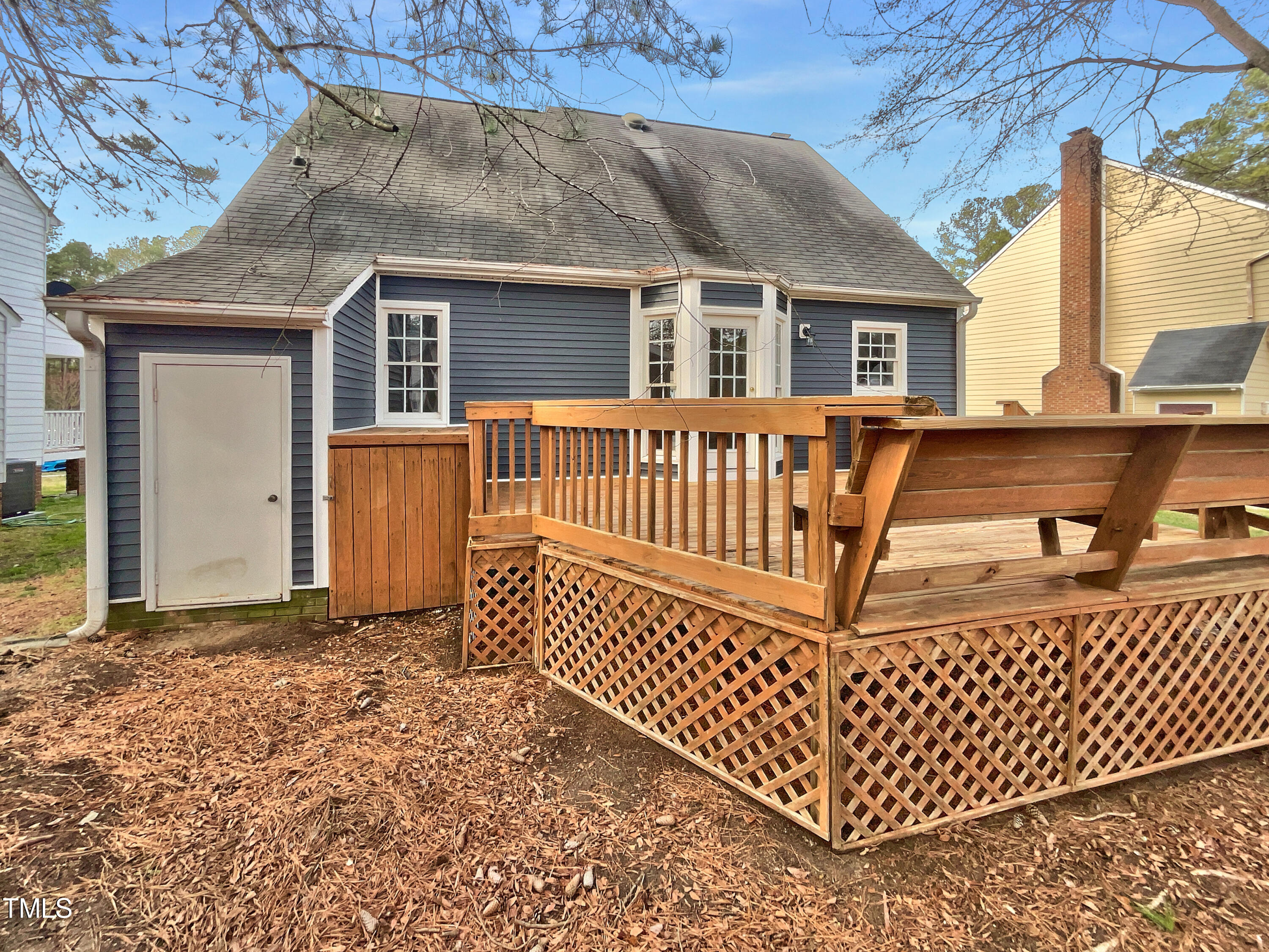 7212 Ewing Place Raleigh, NC 27616 - Photo 17 of 19 a view of a house with wooden deck