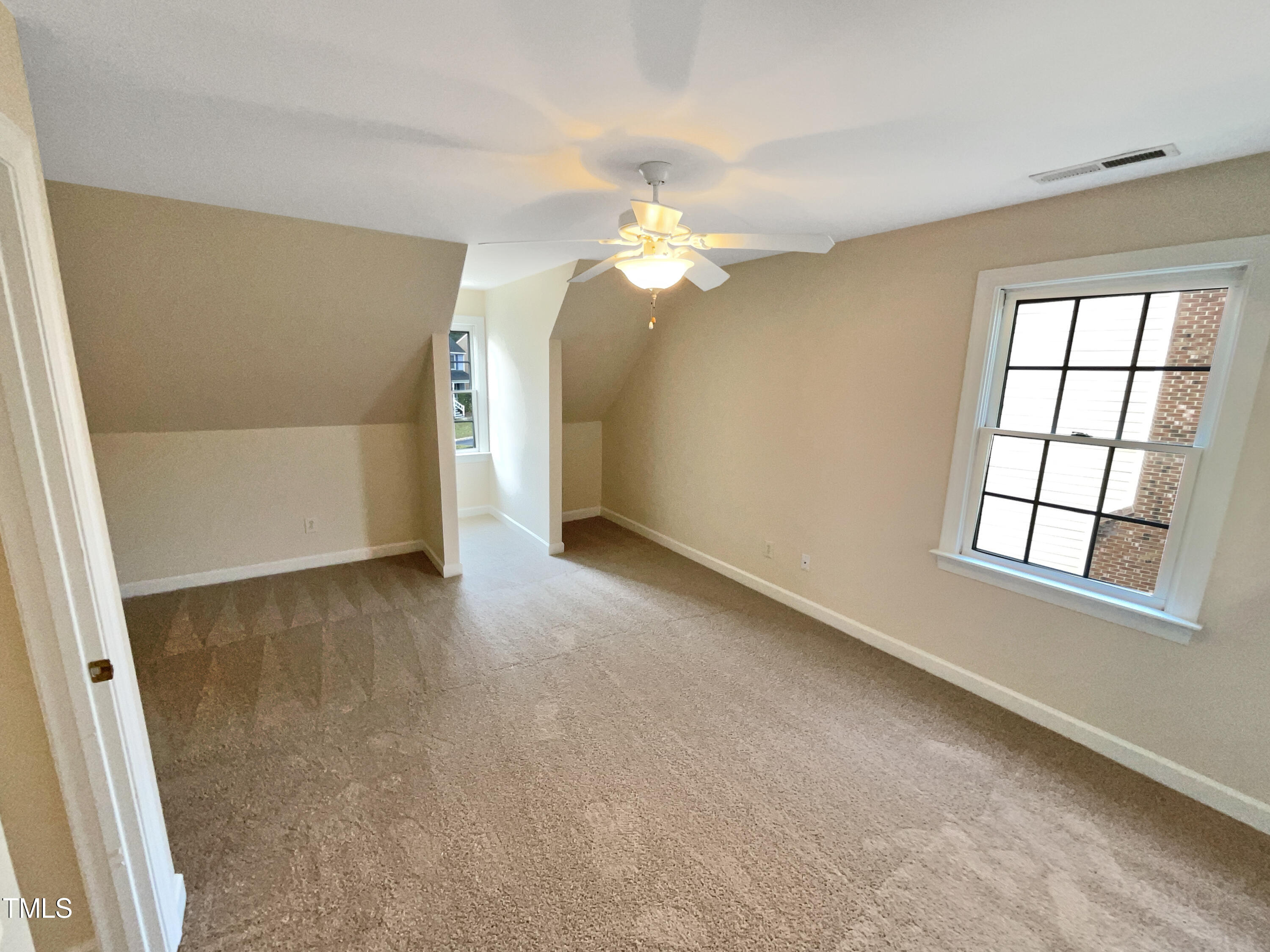 7212 Ewing Place Raleigh, NC 27616 - Photo 5 of 19 wooden floor in an empty room with a window