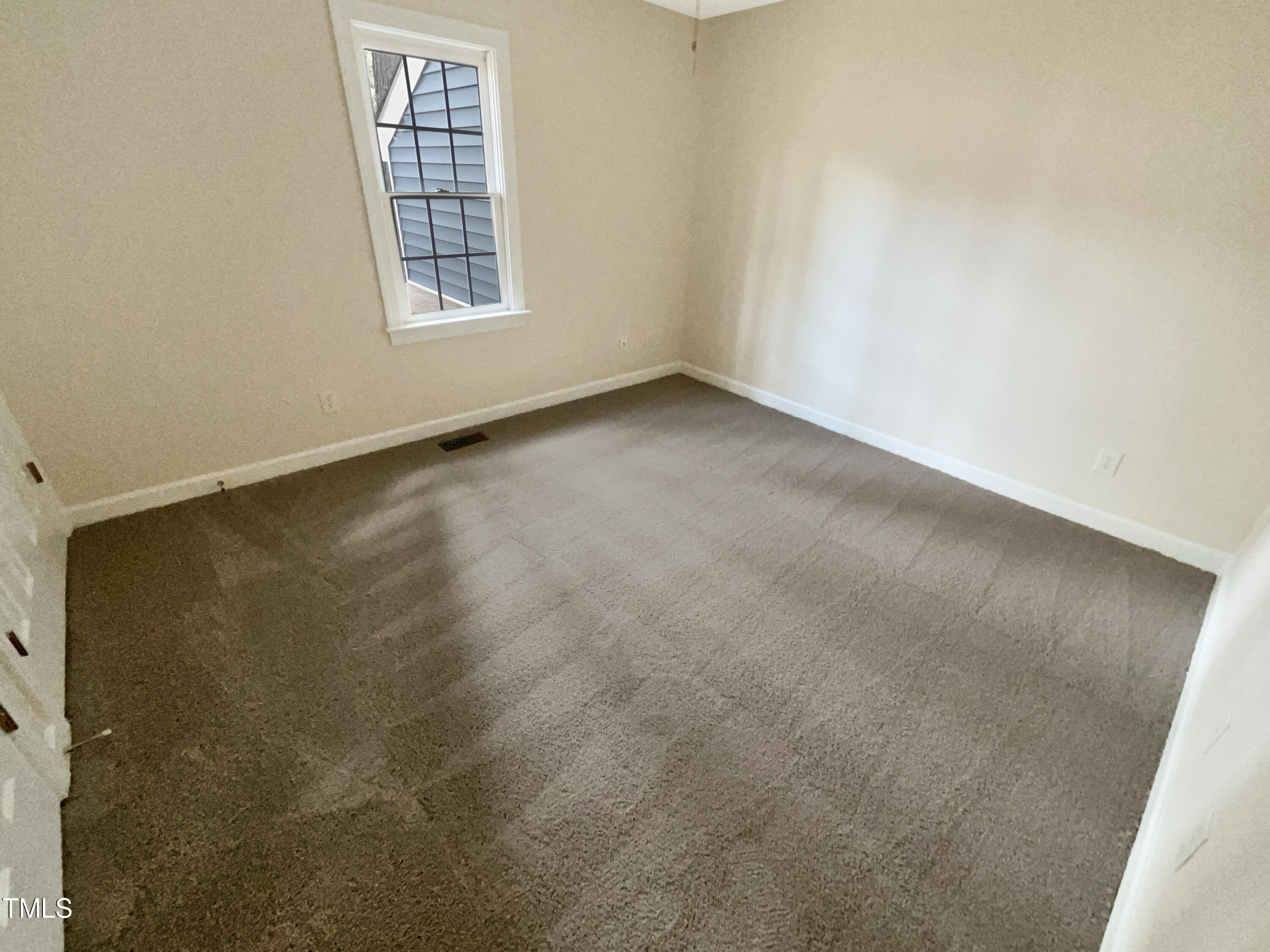 7212 Ewing Place Raleigh, NC 27616 - Photo 9 of 19 an empty room with windows