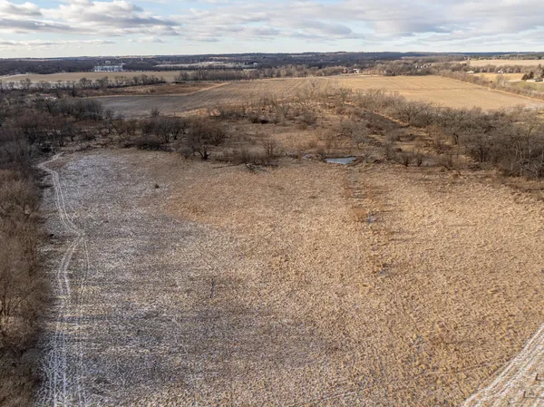 a picture of water heater room with wooden floor