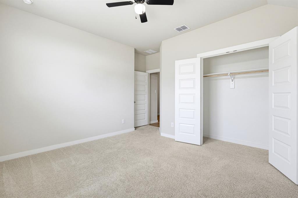 2108 Mossfield Lane Forney, TX 75126 - Photo 28 of 28 Carpeted room with a black ceiling fan, recessed lighting, and a bi-fold closet with panel doors