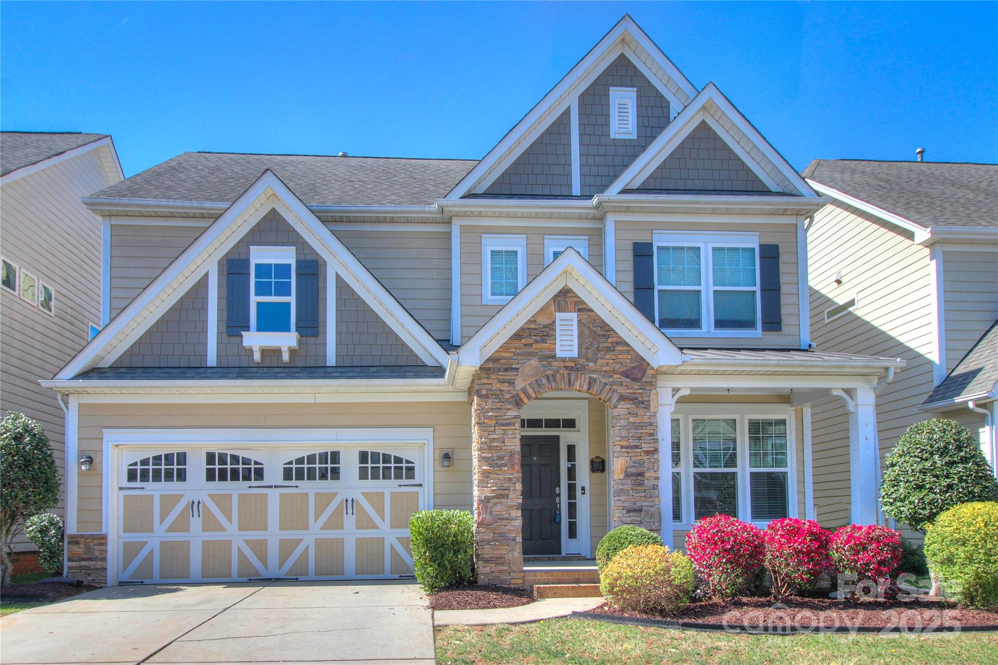 a front view of a house with a yard