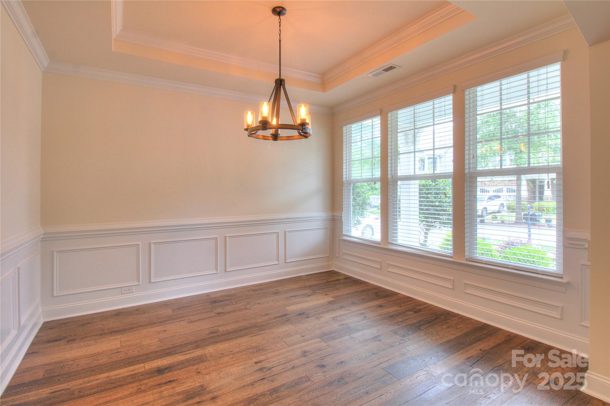 1012 Equipoise Drive Indian Trail, NC 28079 - Photo 14 of 31 a view of empty room with wooden floor and fan