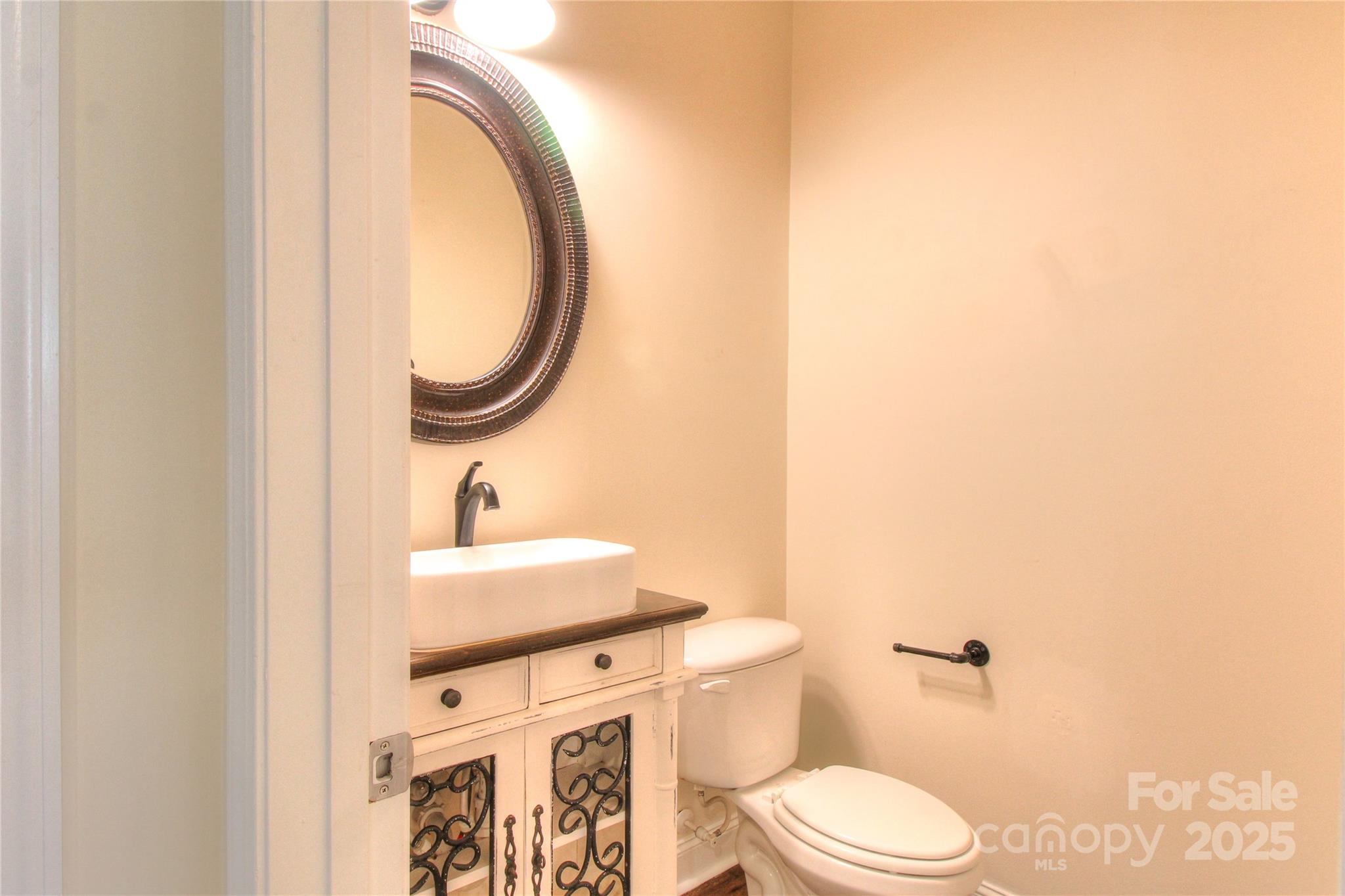 1012 Equipoise Drive Indian Trail, NC 28079 - Photo 17 of 31 a bathroom with a sink a toilet and a mirror