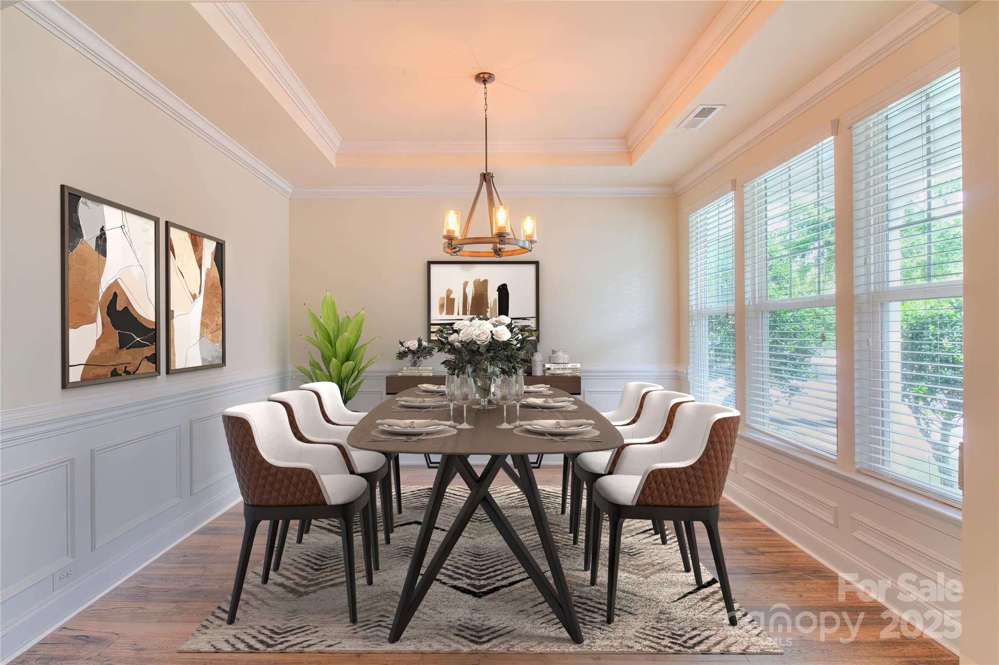 1012 Equipoise Drive Indian Trail, NC 28079 - Photo 4 of 31 a dining room with furniture a chandelier and wooden floor