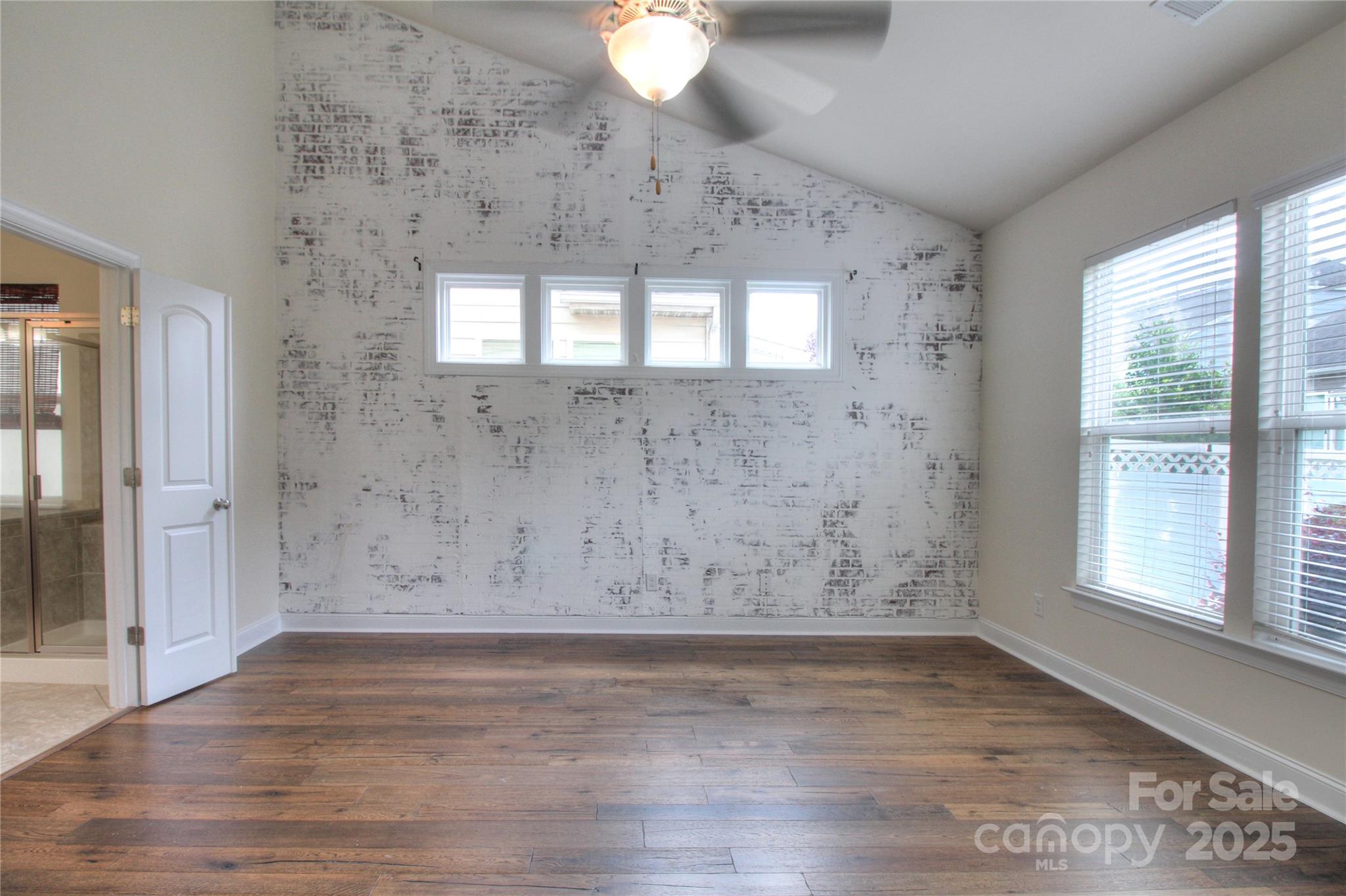 1012 Equipoise Drive Indian Trail, NC 28079 - Photo 9 of 31 an empty room with wooden floor and windows