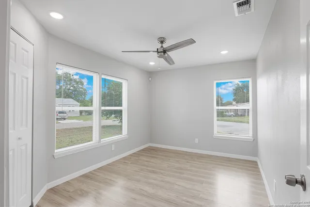 a view of an empty room with a window