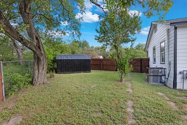 a backyard of a house with lots of green space