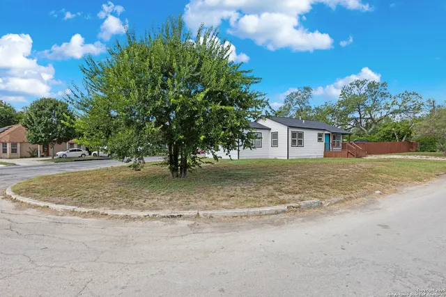 a backyard of a house with lots of green space