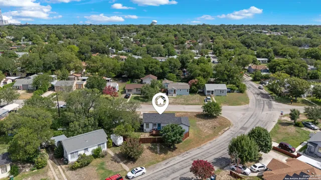an aerial view of a house with outdoor space