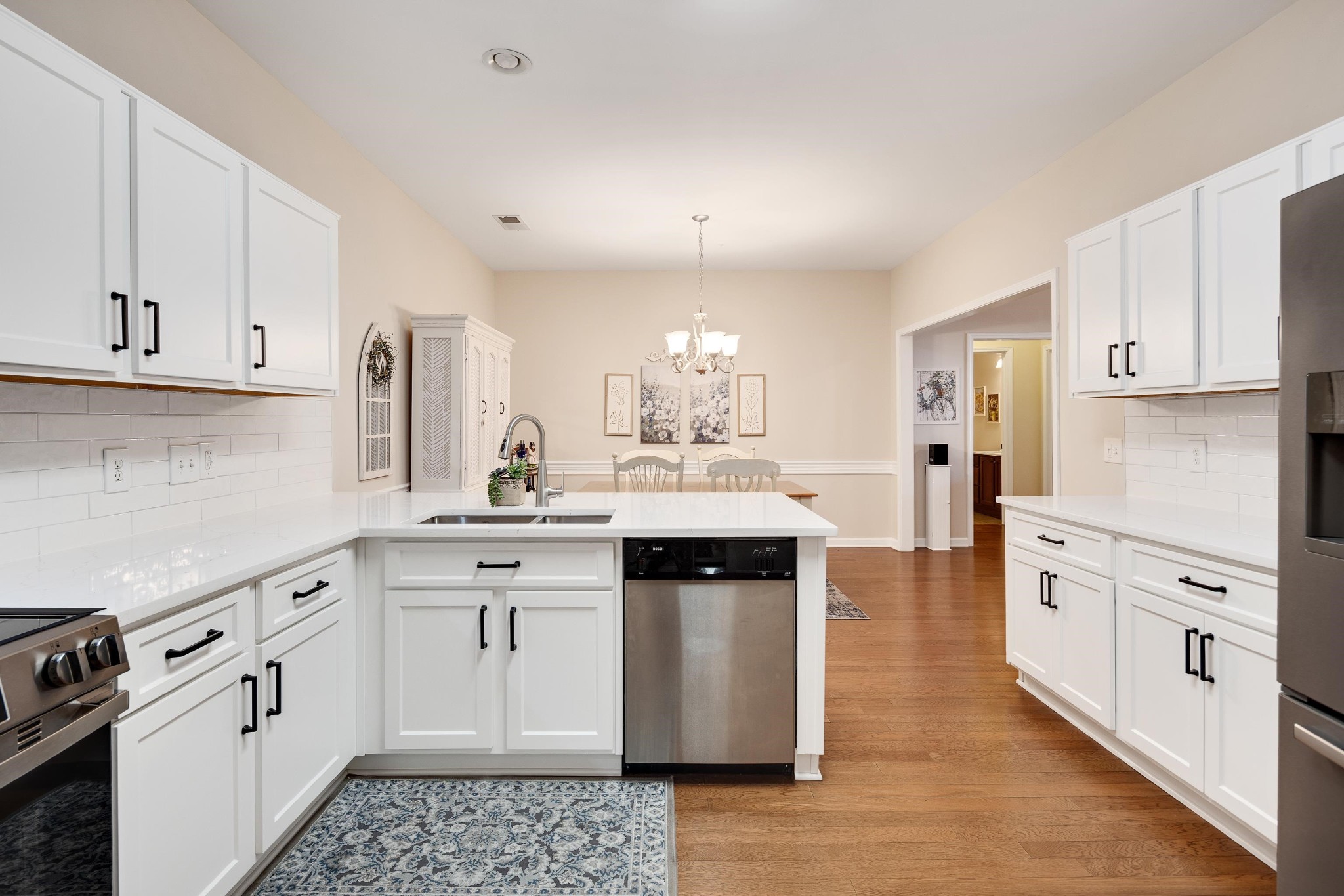 41 Peyton Ridge Drive, Unit 39 Collierville, TN 38017 - Photo 11 of 28 a kitchen with white cabinets appliances and sink