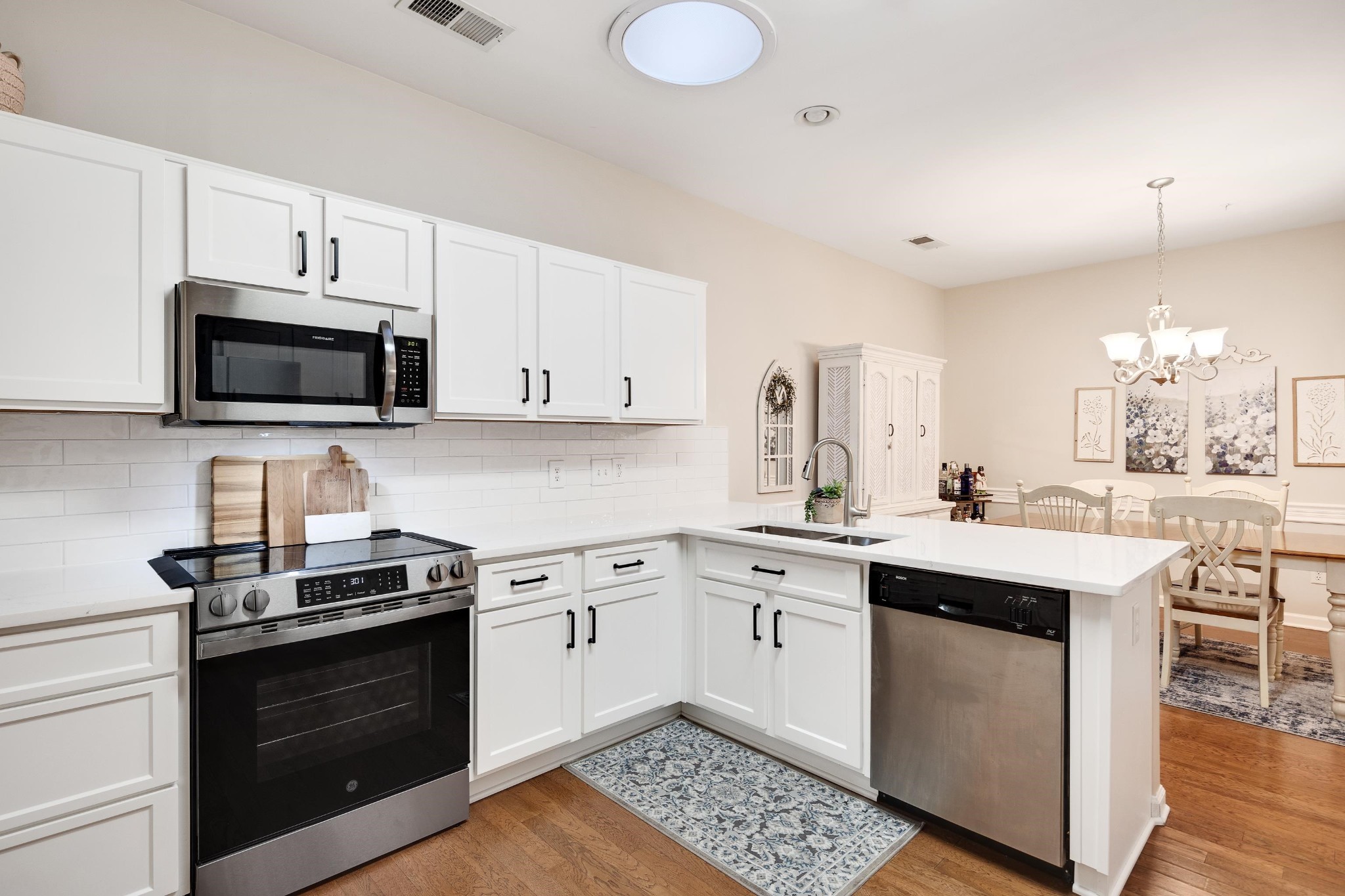 41 Peyton Ridge Drive, Unit 39 Collierville, TN 38017 - Photo 12 of 28 a kitchen with a sink stove and microwave