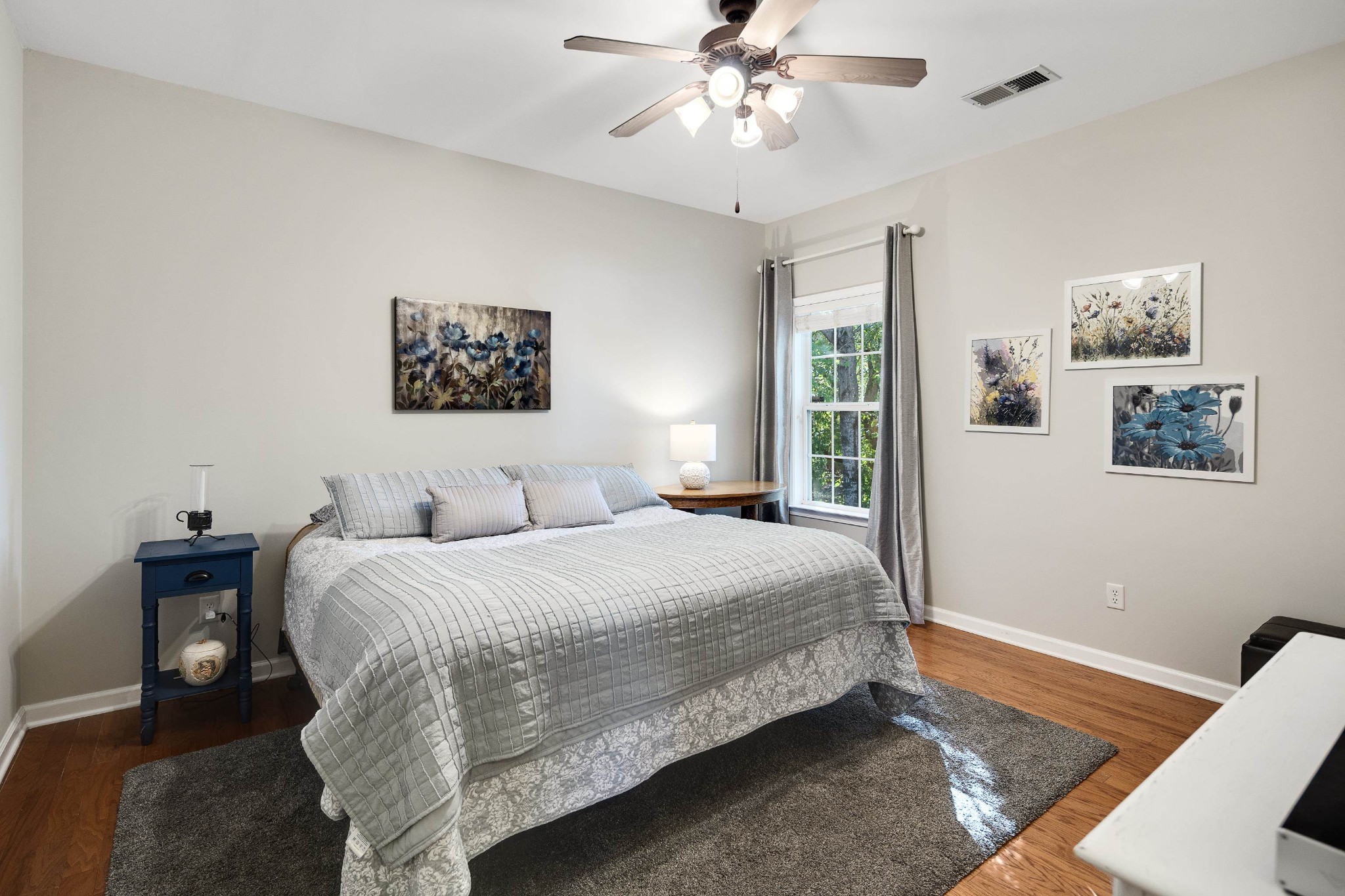 41 Peyton Ridge Drive, Unit 39 Collierville, TN 38017 - Photo 15 of 28 a bedroom with a large bed and a chandelier