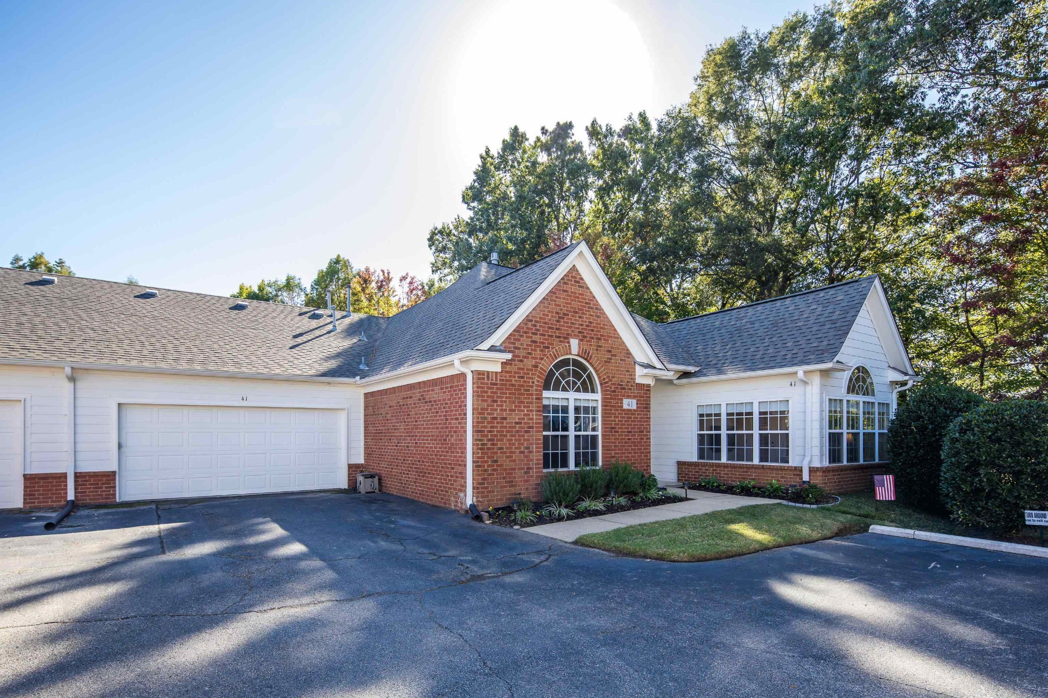 41 Peyton Ridge Drive, Unit 39 Collierville, TN 38017 - Photo 28 of 28 a view of a yard in front of a house with a large tree