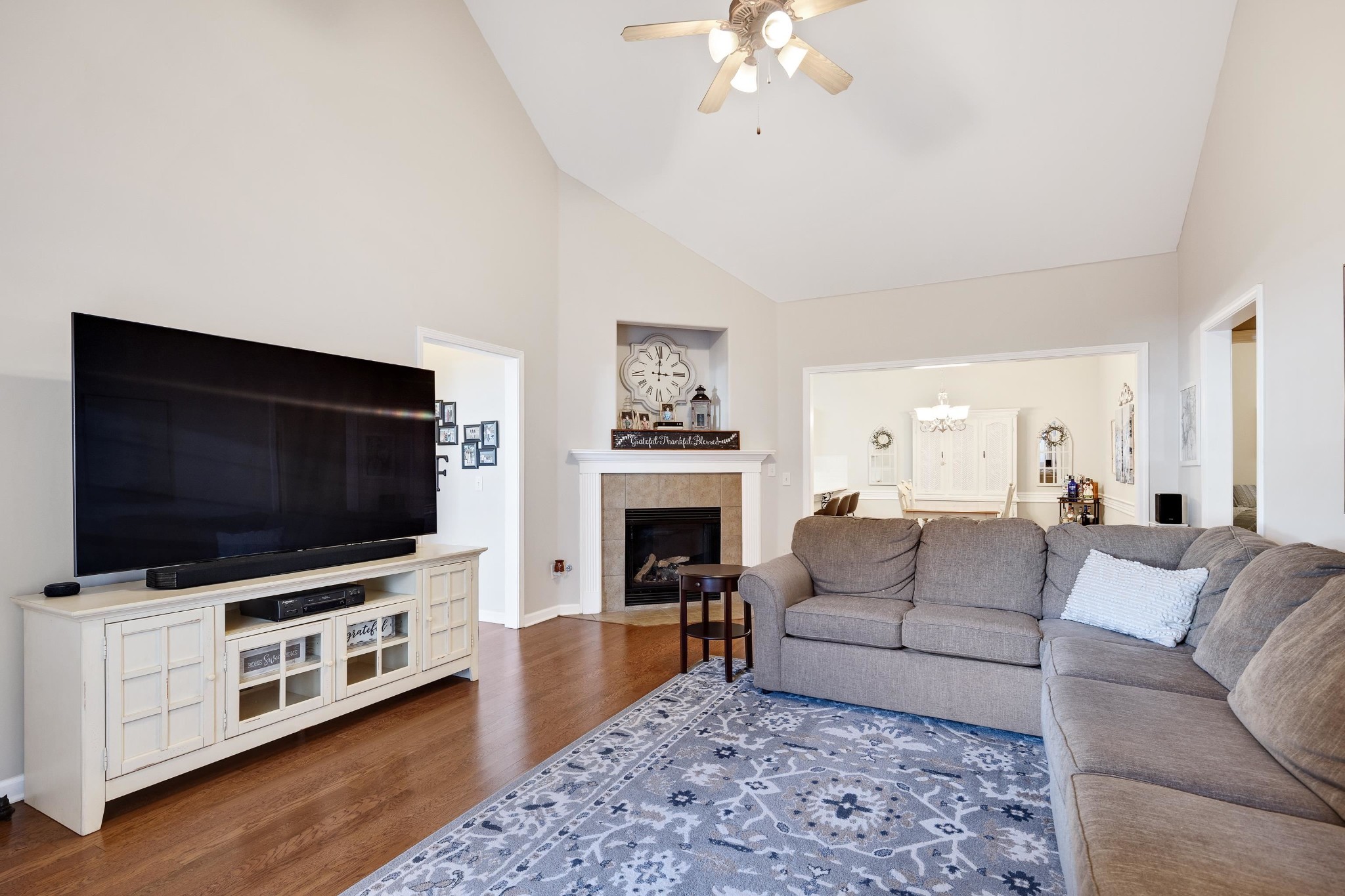41 Peyton Ridge Drive, Unit 39 Collierville, TN 38017 - Photo 3 of 28 a living room with furniture a flat screen tv and a fireplace