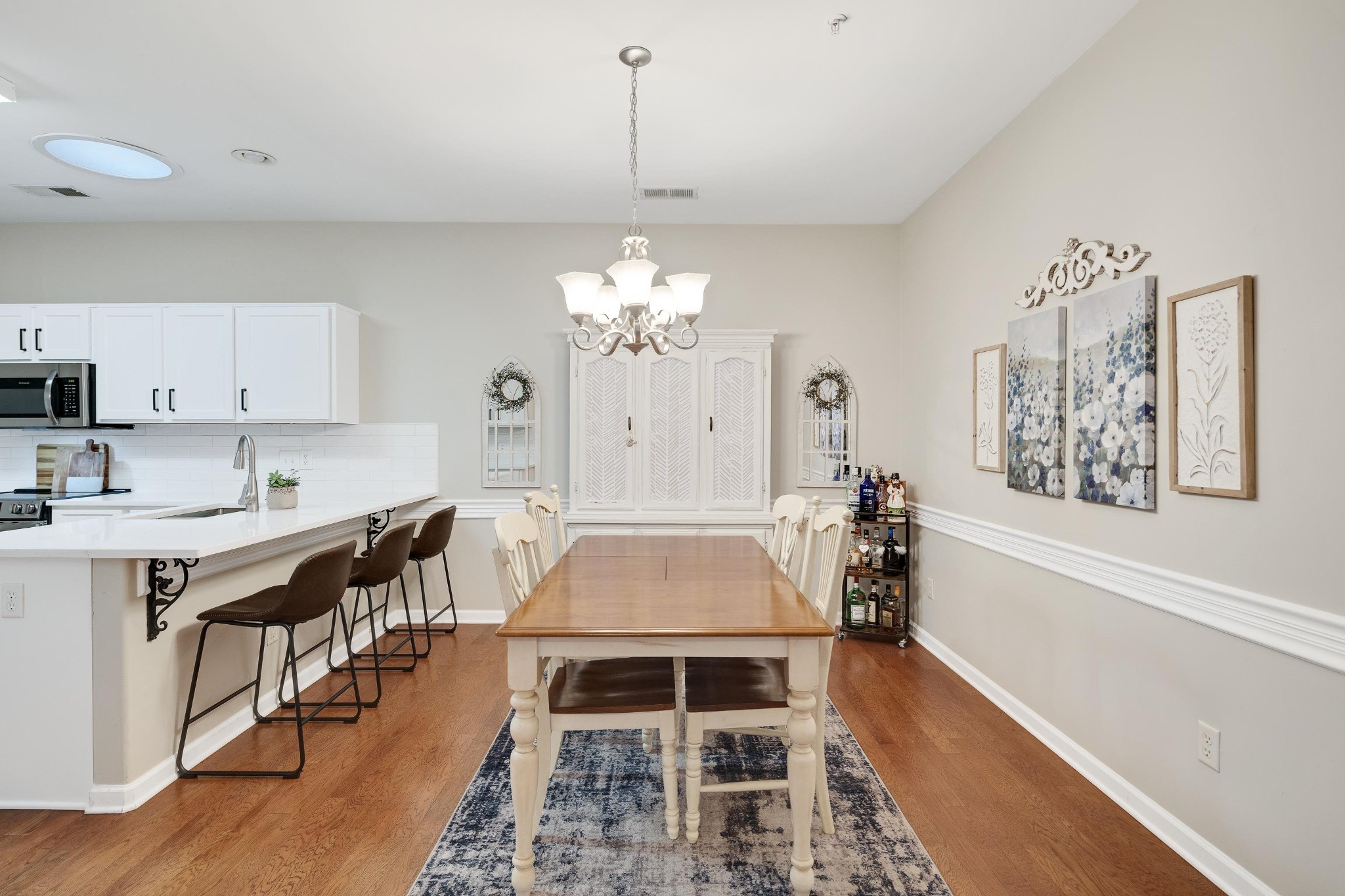 41 Peyton Ridge Drive, Unit 39 Collierville, TN 38017 - Photo 8 of 28 a kitchen with stainless steel appliances a dining table and stove top oven